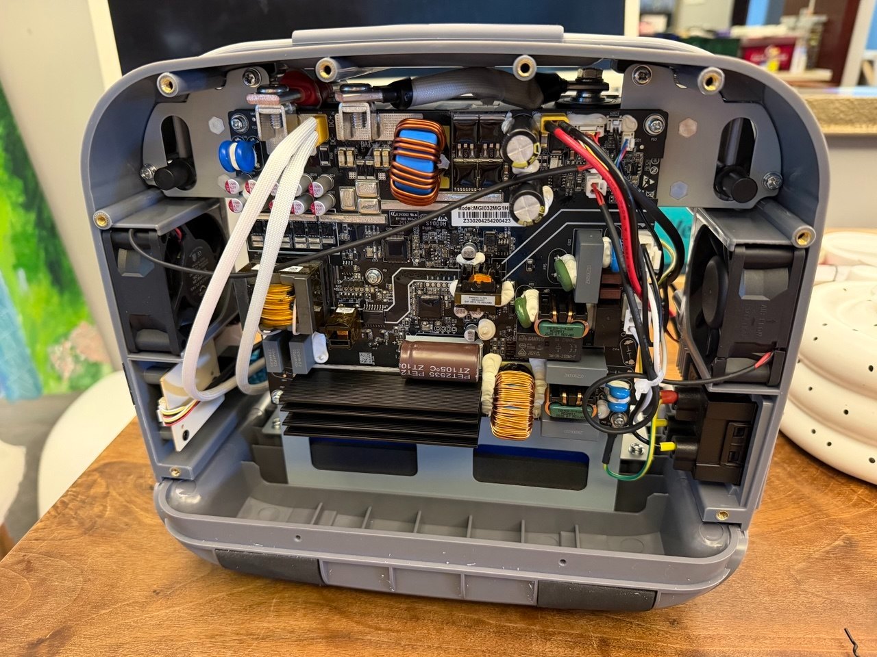 eCandle 1 with the shell removed, showing the inverter board, control electronics, heat sink and twin cooling fans